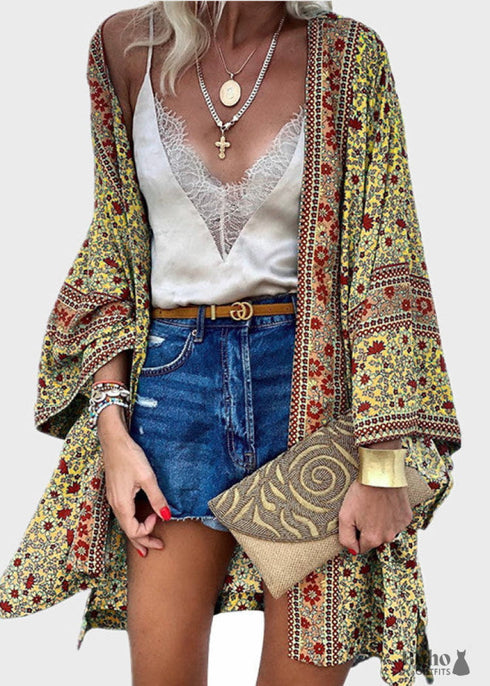 Cárdigan bohemio amarillo de punto de crochet calado con borlas estilo 2024